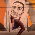 Black female @jazzantiqua dancer in a hinge in front of George Floyd mural in LA.