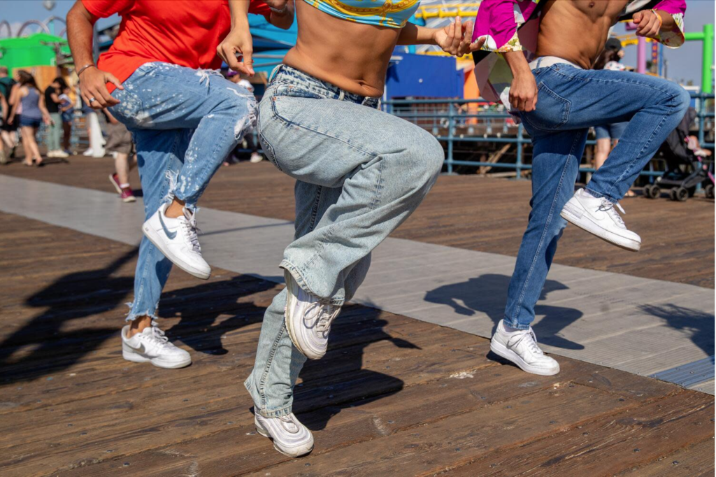Justin Corbo, Vanesa Seco and Kento Moriguchi perform a shuffle dance routine on the Santa Monica Pier. (Mel Melcon / Los Angeles Times)